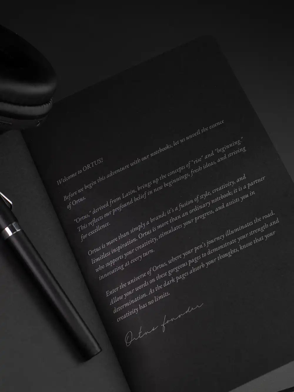 Ortus black notebook and silver pen