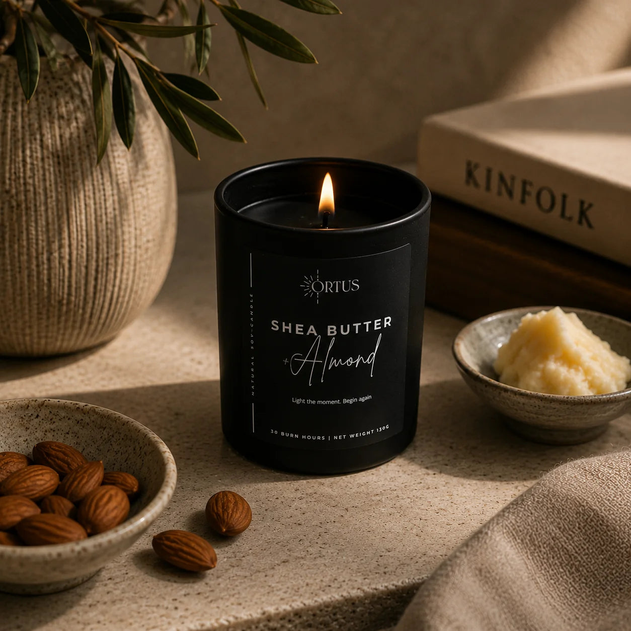 Ortus black candle on a desk