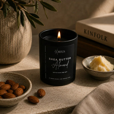 Ortus black candle on a desk
